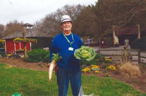 man holding large vegetables